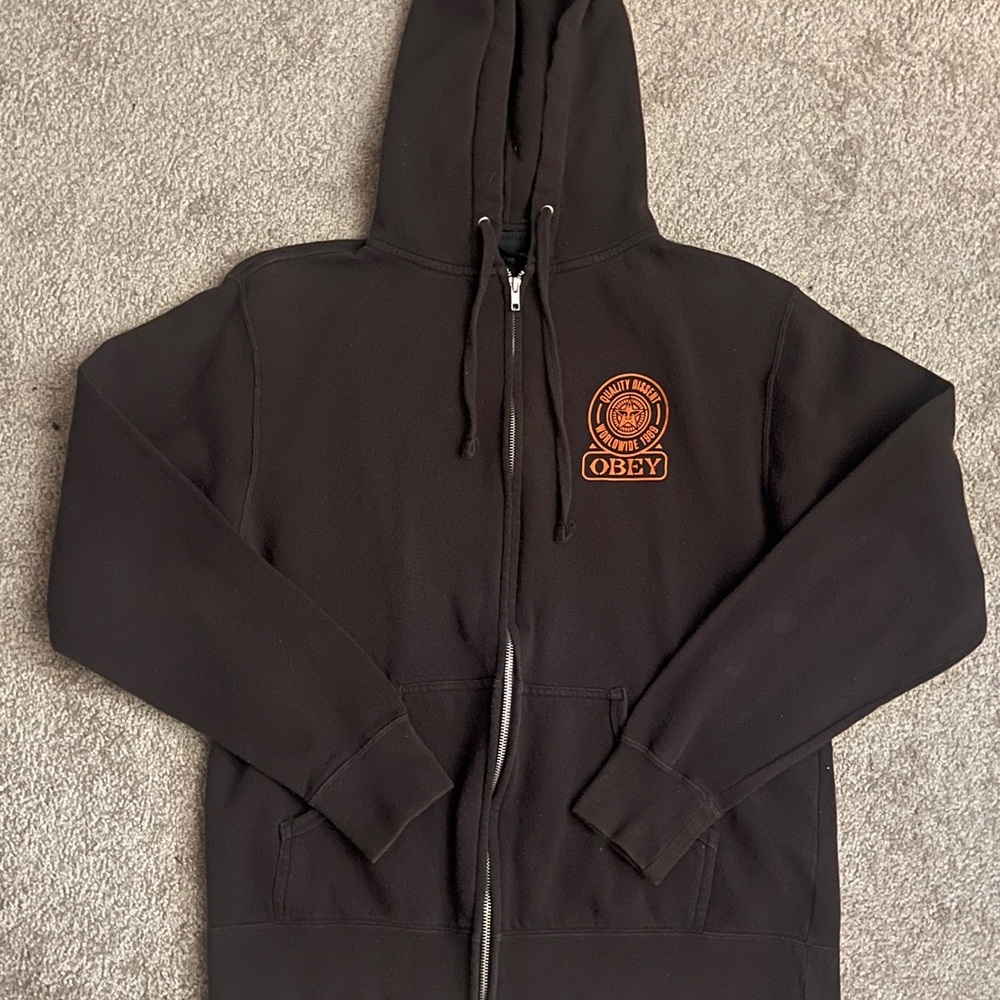 Obey Black Zip-Up Hoodie with Orange Emblem